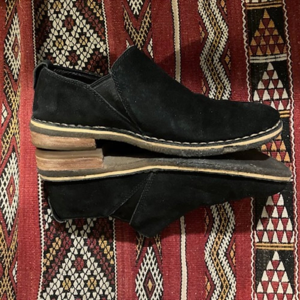 UGG black suede ankle slip on bootie with shearling insole,  rubber sole.